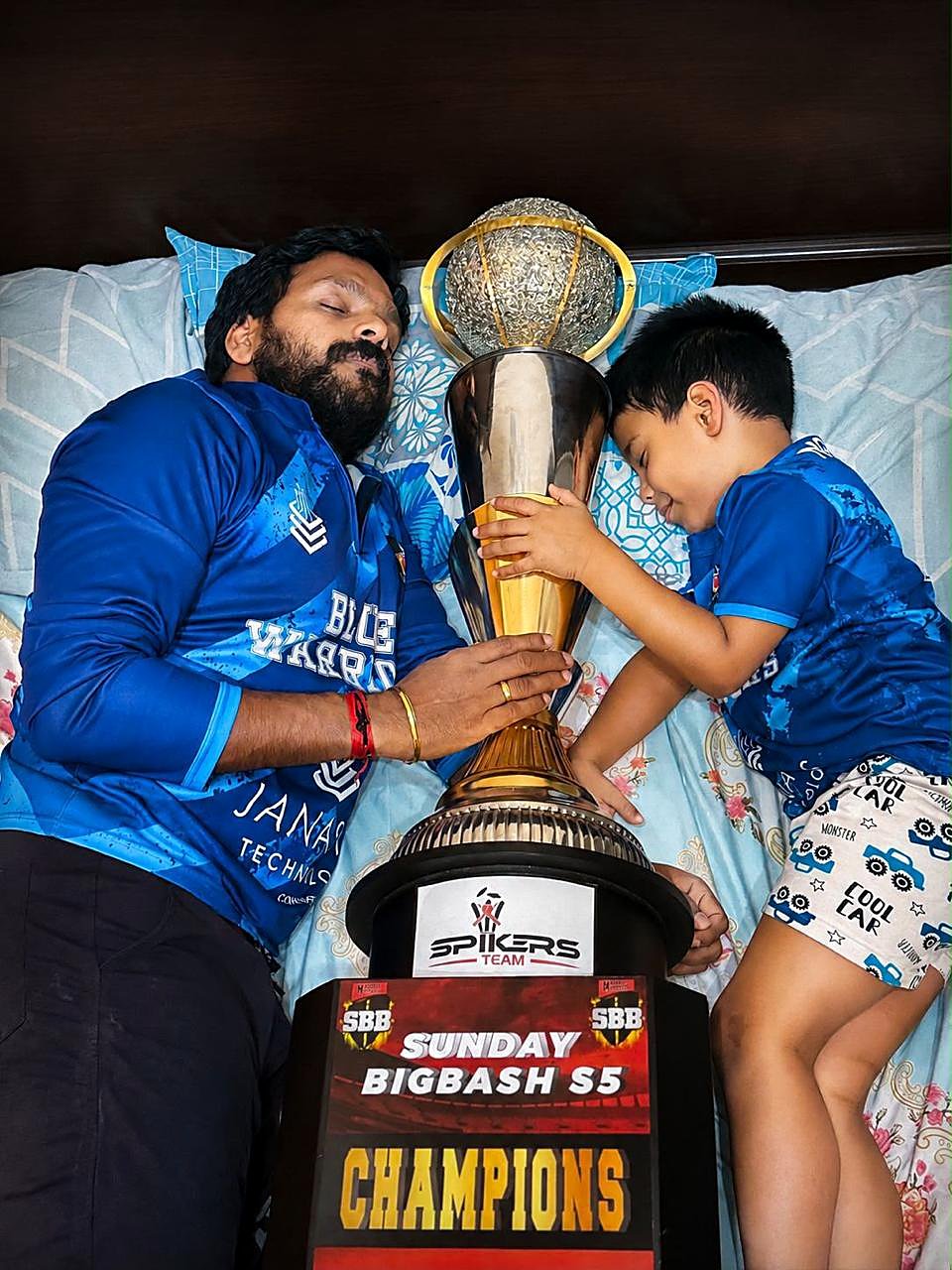 Father and son, with the cup